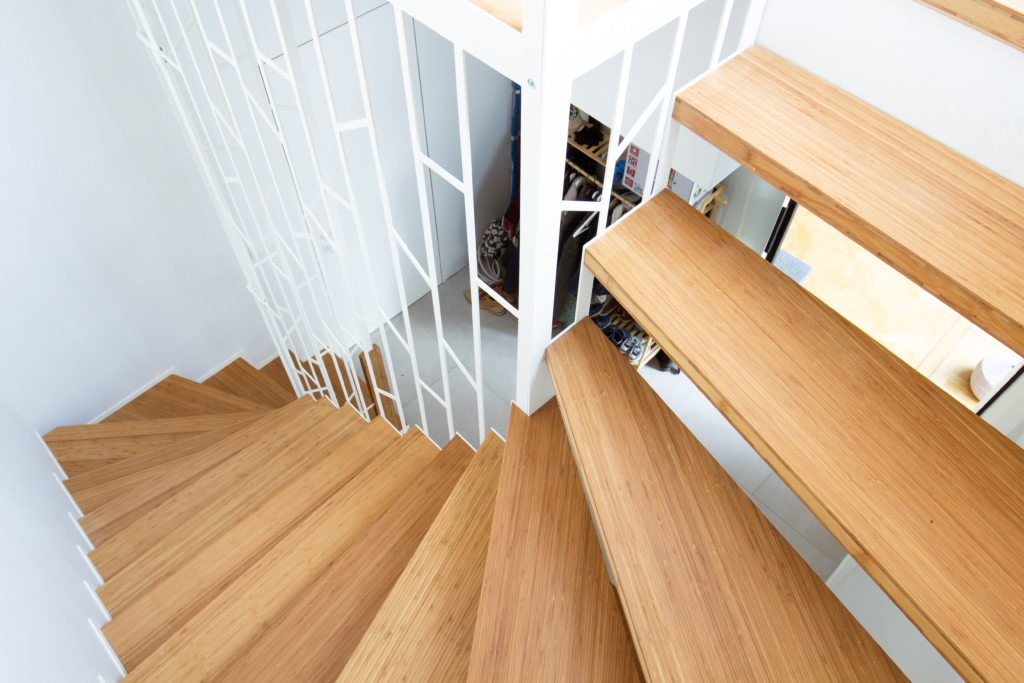 Custom-made suspended staircase with toilet and built-in furniture